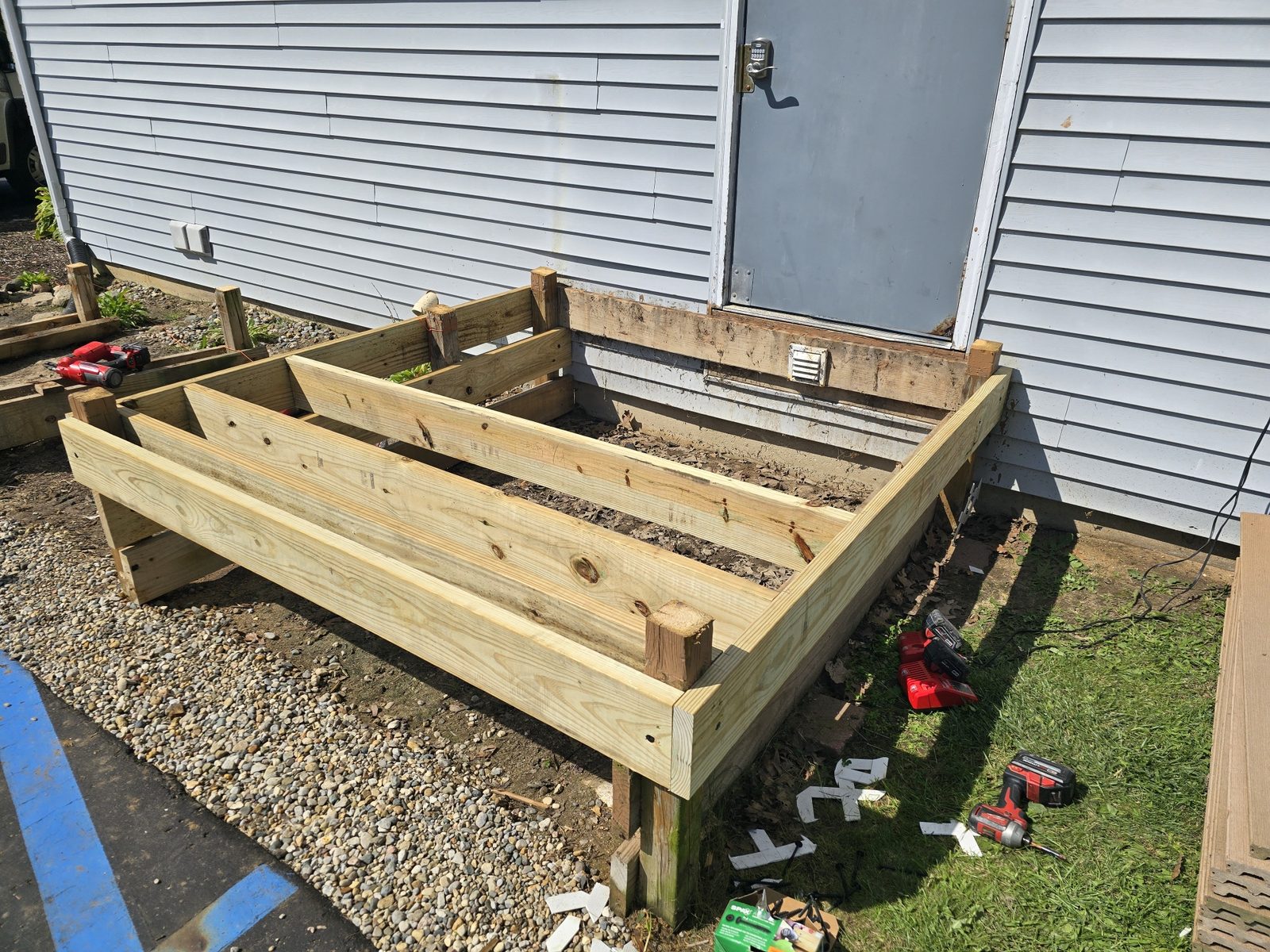 New pressure treated landing frame built at an entry door for an accessible ramp in Southwest Michigan