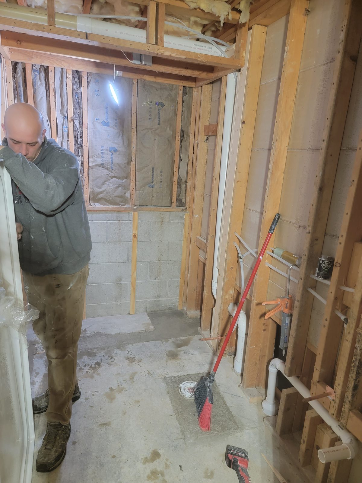 Basement bathroom framed, insulated and plumbed during the rough in phase in Southwest Michigan
