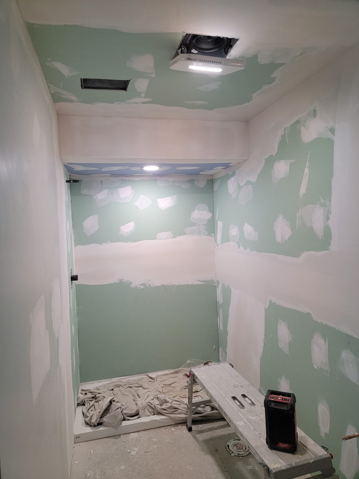 Moisture resistant drywall and a new exhaust fan in a basement bathroom remodel in Southwest Michigan