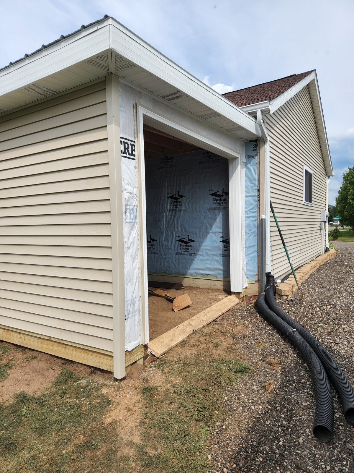 Vinyl siding installed on a garage addition to match the house in Southwest Michigan