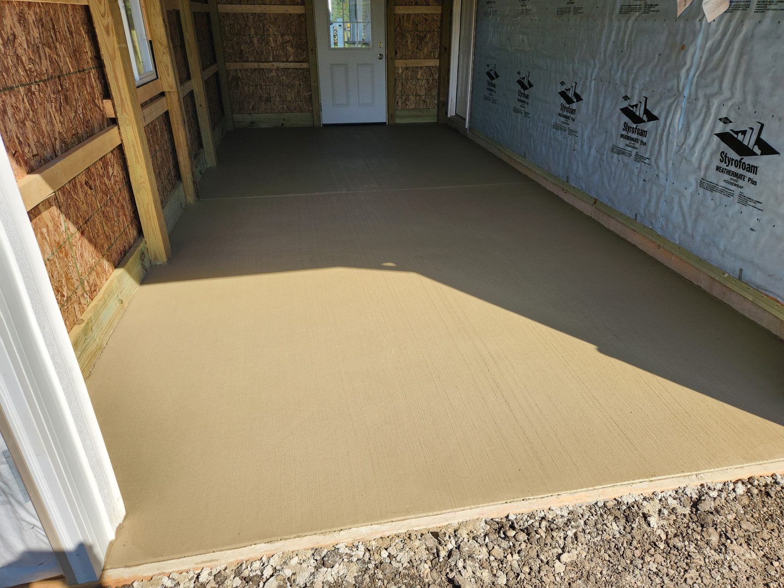 New concrete floor poured in an attached garage addition in Southwest Michigan