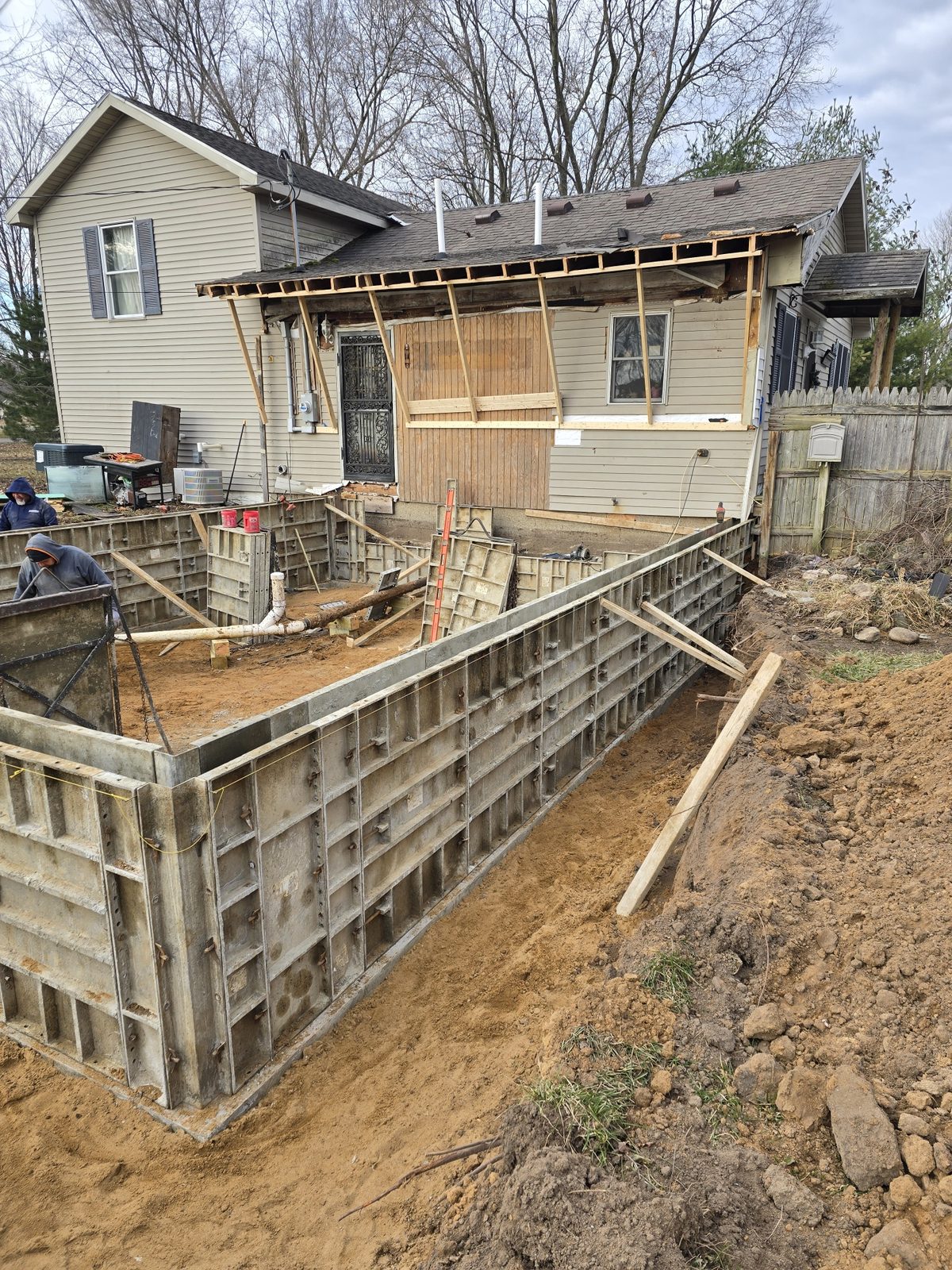 Concrete foundation wall forms set in place for a new room addition in Southwest Michigan
